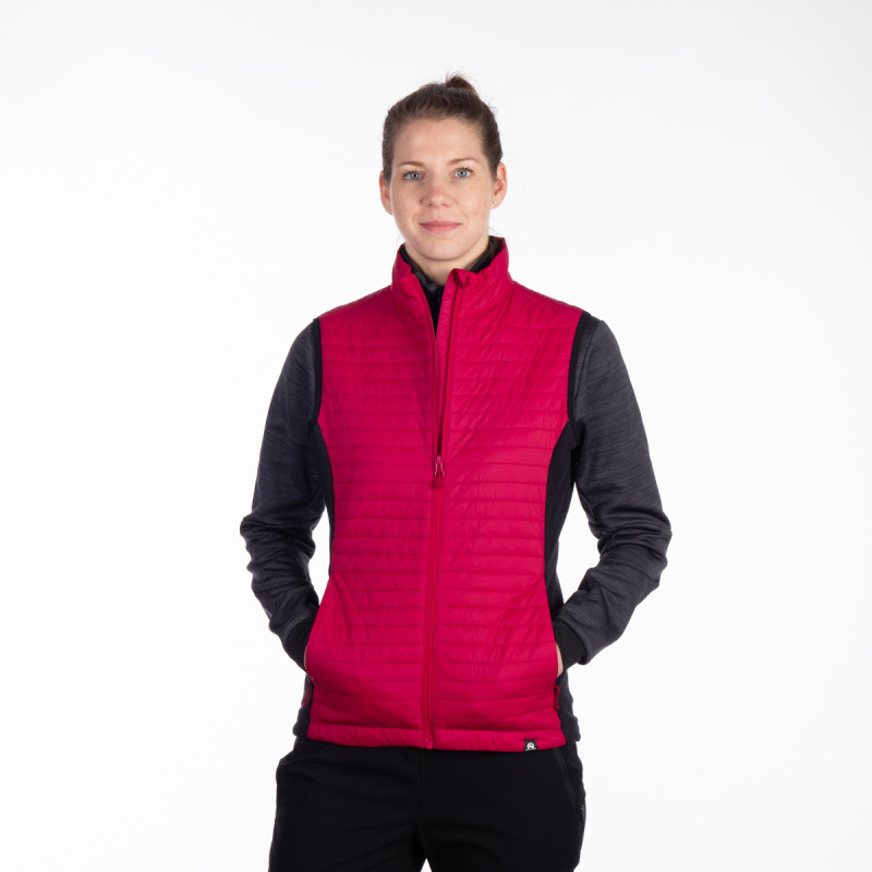Women's vest water-repellent resistant KIERA VE-60001OR - <ul><li>Universal hybrid vest of classic cut is a combination of wind-resistant front part and breathable back part made of fleece material</li><li> The combination of materials allows for universal normal use and outdoor activities</li><li> The front part and shoulder parts are insulated with synthetic filling, with an excellent ratio of thermal insulation properties and weight</li>